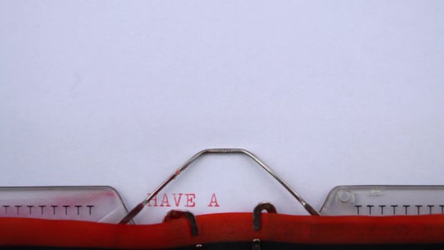 Have a nice day - phrase printed on an old typewriter in red letters, close up. vintage inscription - Powered by Adobe