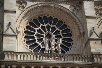 Big glass window and sculptures of Notre Dame de Paris, France