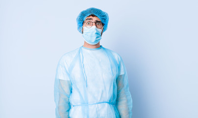 young man feeling clueless, confused and uncertain about which option to pick, trying to solve the...