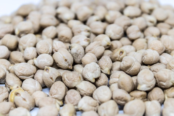 Heap of raw chickpea (Cicer arietinum), chickpeas on white background, chickpea seeds - healthy food, hummus ingredient - Image