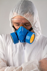 Portrait of man with closed eyes wearing respiratory mask and clothing. Isolated on white...