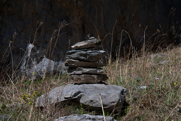 Fototapeta na wymiar A pyramid of stones in the Altai mountains