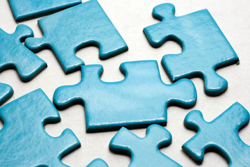 Blue puzzle pieces on white background.