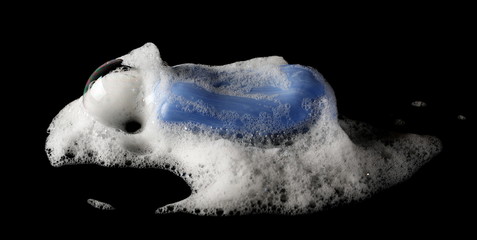 Foam and blue soap, bubble isolated on black, with clipping path texture and background 