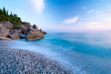 beach in Himare at evening, wave of sea on long time exposure, Albania