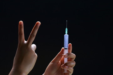 hand with syringe