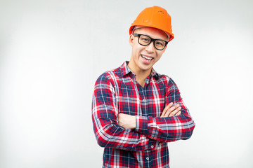 man in glasses with an orange helmet for safety on a white background