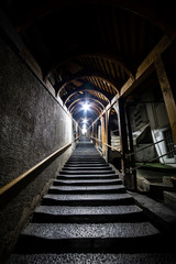 Dark moody stairs going upwards