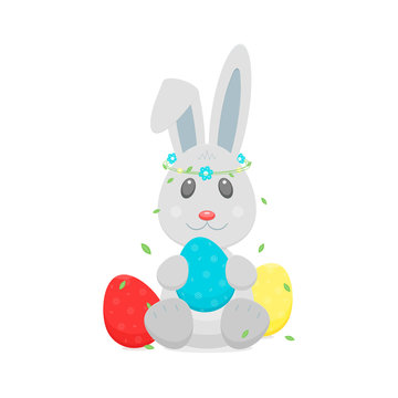 Easter eggs, bunny rabbit with wreath on head.