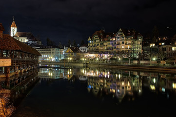 Fototapeta na wymiar Night Light buildings with reflection in water