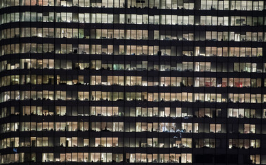 Obraz na płótnie Canvas business office at night - corporate building
