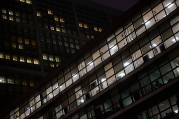 Obraz premium business office at night - corporate building
