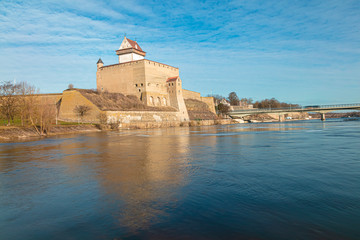 Fototapeta na wymiar Old fortress by the river Narva. Awesome view of the castle.