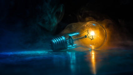 Abstract dark background with creative artwork decoration of glowing bulbs.