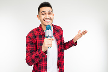 performer guy singer in a shirt with a microphone in his hands on a white background
