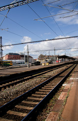 Fototapeta na wymiar Tracks on empty Train station in Europe