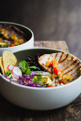 Cerdo Bowl of Roasted pork, pilaf rice, black beans, salad and banana chips