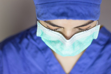 Aerial view of nurse with mask and hat to protect against coronavirus.