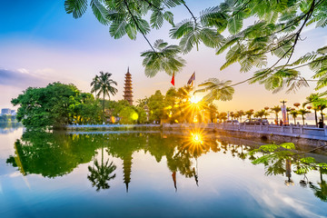 Tran Quoc pagoda in the afternoon in Hanoi, Vietnam. This pagoda locates on a small island near the southeastern shore of West Lake. This is the oldest Buddhist temple and tourist destination in Hanoi - obrazy, fototapety, plakaty
