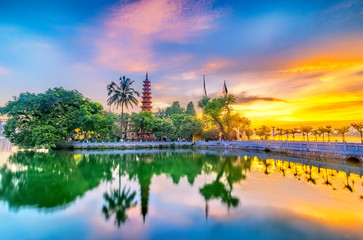 Tran Quoc pagoda in the afternoon in Hanoi, Vietnam. This pagoda locates on a small island near the southeastern shore of West Lake. This is the oldest Buddhist temple and tourist destination in Hanoi - obrazy, fototapety, plakaty