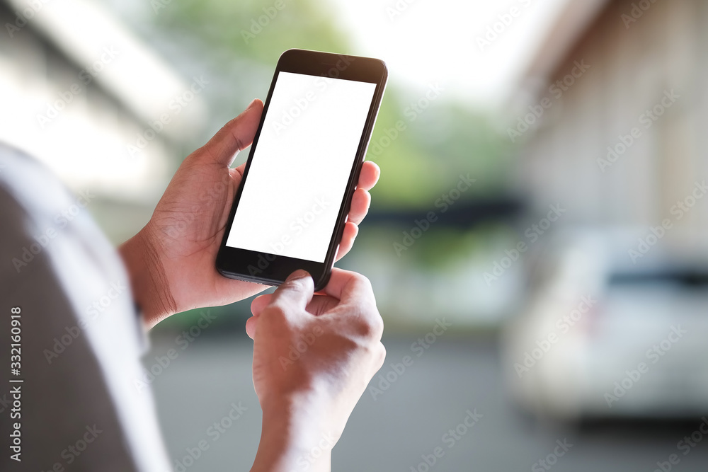 Wall mural cropped shot view of man hands holding smart phone with blank copy space screen for your text messag