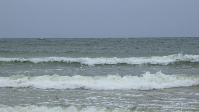 Waves crashing into shore of baltic sea in sopot.