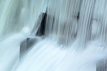 Naklejka na ściany i meble Frozen waterfall flow from an electrical barrage