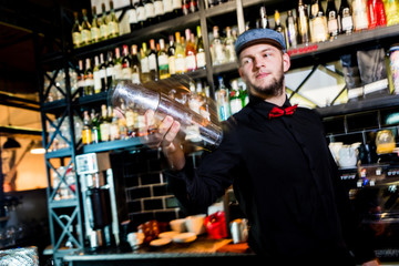 Bartender is making cocktail at bar counter. Fresh cocktails. 