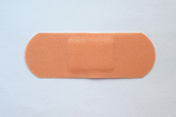 A large medical bactericidal woven patch on a white background. elastic patch top view.