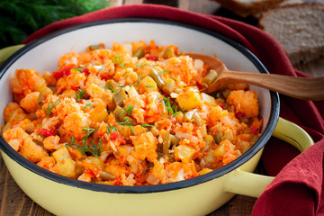 Vegetable stew with cauliflower in an enamel pan, selective focus