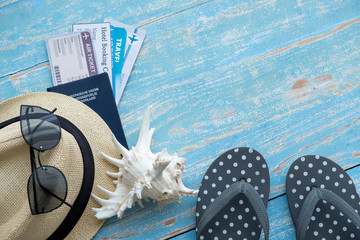 Beach accessories on blue wooden table. Summer concept