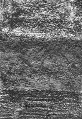 Texture of paper with prints of charcoal.