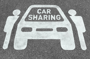 Car sharing parking symbols painted onto asphalt road. Car sharing service or rental concept....