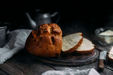 Wheat flour bread on the table. Sandwich with butter