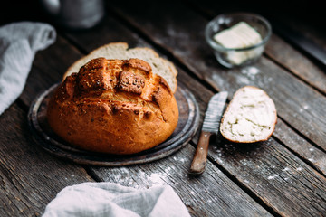 Wheat flour bread on the table. Sandwich with butter