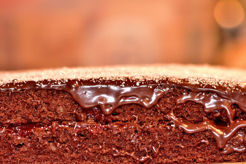 Texture of baked gingerbreads with strawberry jam and chocolate cream.