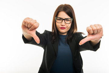 Portrait of business girl wearing glasses showing double dislike gesture