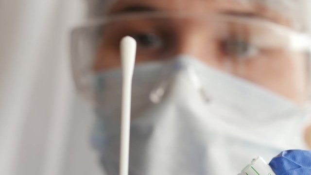 doctor opening a swab, nasal and throat swab