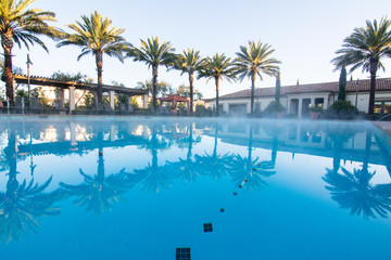 Fototapeta na wymiar Luxury association pool at sunrise 