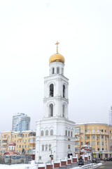 Fototapeta na wymiar Russian orthodox church of Saint Nicholas in the bell tower in Samara, Russia - 7 february 2020 year. Soft focus