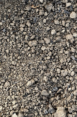 Black nourishing ground prepared for planting. Spring field preparation for sowing texture. Vertical photo.