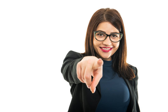 Portrait of young business girl wearing glasses pointing camera