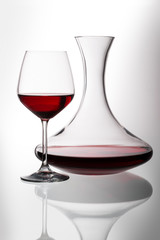 Decanter and glass with red wine