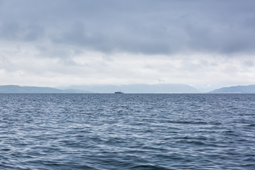 Scenic high rocks in the Pacific Ocean. Kamchatka Peninsula.