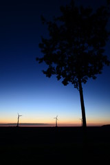 wind generator in the evening mood in Germany as a silhouette