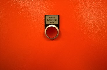 acknowledge button with red button on orange background