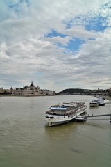 Fototapeta na wymiar the parliament in budapest in hungary with the danube and river cruise ships