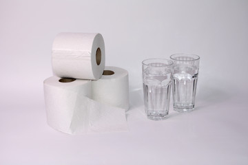 Toilet paper rolls with two glasses of water
