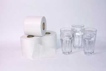 Toilet paper rolls with three glasses of water