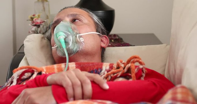 Home Quarantine or İsolation Concept  Epidemic Infection Covid-19  Coronavirus Patient  With Nebulizer Mask Resting At Home